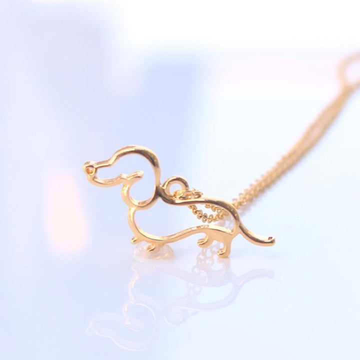 The Pink Pigs Fashion Necklace Gold-color Dachshund Fashion Necklaces in silver or gold plated!  SO CUTE!